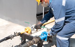 licensed plumber installing commercial gas line